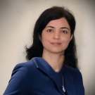 Dr. Azra Jahanitabesh, smiling and wearing a professional outfit.